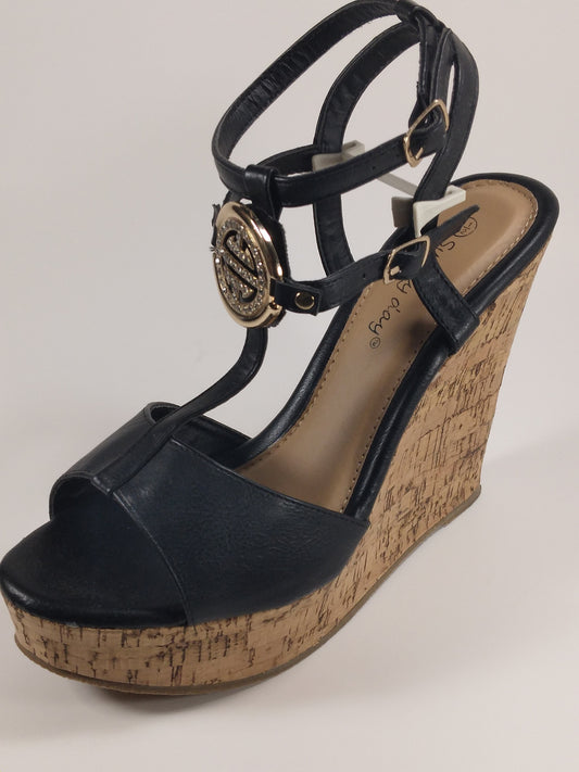 3.5 inch Black T strap wedge with gold/rhinestone emblem a cork heel