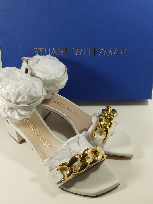 Stuart Weitzman Amelina Block heel sandal with gold chain over single strap.